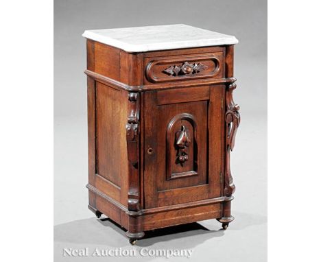 American Renaissance Walnut Commode , 19th c., stamped "Beal and Hooper, Manufacturers, Boston", marble top, carved paneled d