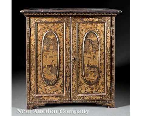 Chinese Export Gilt Decorated Black Lacquer Collector's Cabinet , 19th c., molded cornice, oval-paneled doors opening to five