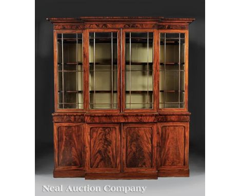 American Classical Carved Mahogany Breakfront-Bookcase , early 19th c., stepped molded cornice, plain frieze, four glazed doo