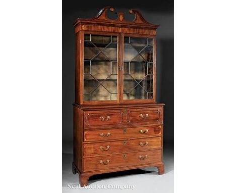 George III Inlaid Mahogany Secretary Bookcase , early 19th c., broken scroll pediment, patera frieze, astragal glazed doors; 