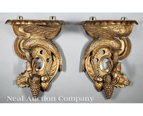 Pair of Neoclassical-Style Carved Giltwood Figural Brackets , 19th c., scalloped shelf over opposing phoenixes, fruit and fol