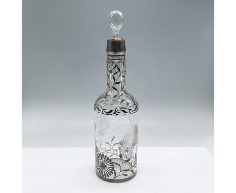 Beautifully etched and painted round decanter with glass faceted stopper. Both etching and painting are of flowers with stems