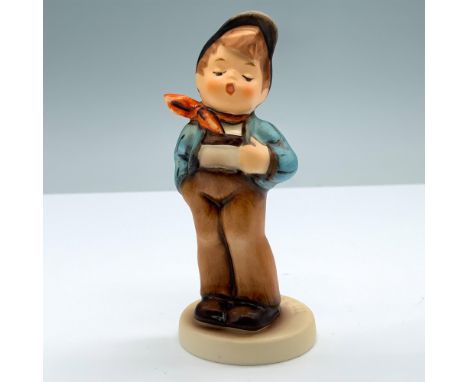 Hand painted porcelain presenting an adorable boy un blue and brown clothes with red scarf. Goebel backstamp. M. I. Hummel im