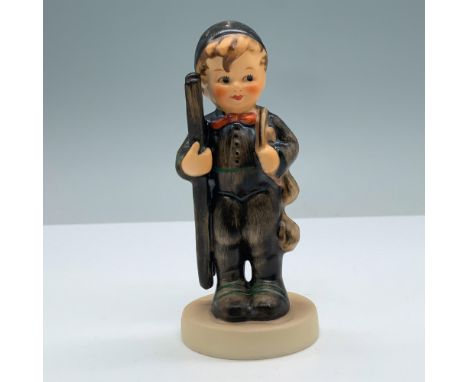 Chimney sweep boy in brown clothing and cap carrying a ladder. Goebel backstamp. M. I. Hummel impressed on the round base. Is