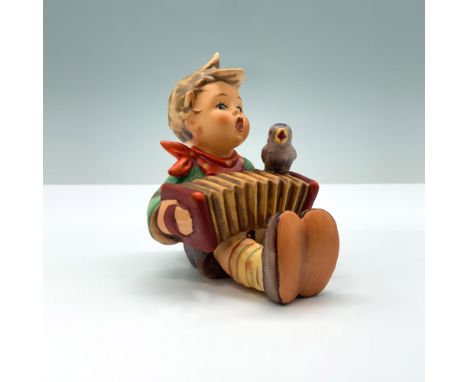 Hand painted porcelain boy with accordion, matte finish. Goebel TMK6. HUM110/0. Artist: Reinhold UngerIssued: 1979-1990Dimens