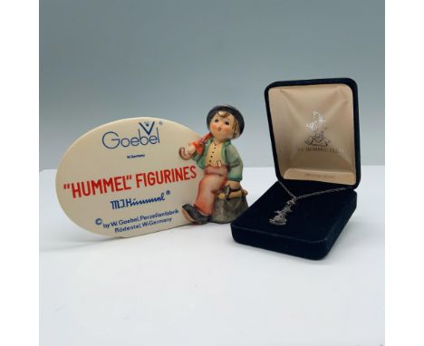 This set features a hand painted plaque that reads Hummel Figurines with characteristic Goebel-Hummel little boy walking with
