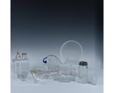 Magnificent variety of clear glassware that consists of a medium and a small swirled ashtrays, a leaf shaped tray, a pebbled 