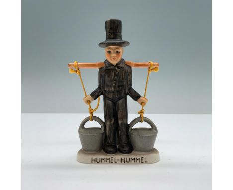 Hand-painted porcelain with matte finish features a mors carrying two water buckets. Goebel backstamp. Hummel-Hummel impresse