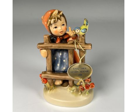 Hand decorated figure of an adorable girl in red hood talking to a bird, capturing a spring atmosphere. Artist impressed sign