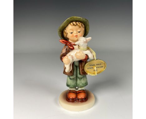Hand decorated figure of an boy holding a sheep. Artist impressed signature in the base. Goebel backstamp. This item includes