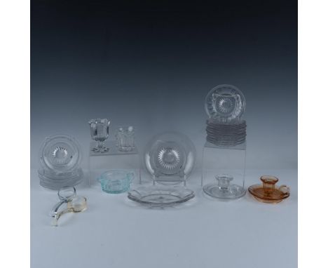 Marvelous collection of glassware that consists of a scalloped oval tray, a round plate with a pinwheel design, a colonial pa