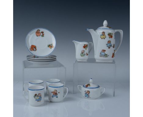 Charming porcelain collection decorated with images of young children playing with toys that consists of a tea pitcher 5.75"L