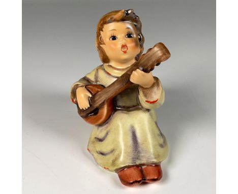 Hand decorated figure of an angel playing a guitar and singing praises. Artist impressed signature in the back. Goebel backst