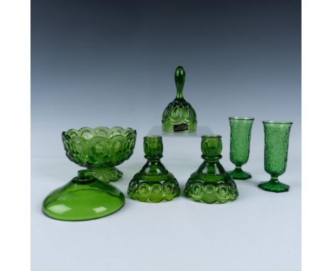 Features a 5 piece green glass moon and stars LE Smith set including two candle holders, a bell, fairy lamp shade and a base 