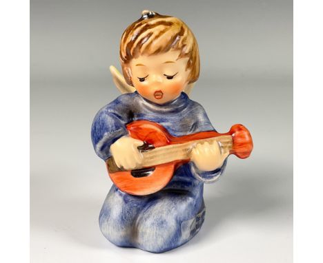 Hand decorated figure of an angel in a blue tunic, playing a guitar and singing praises. Goebel backstamp. This item includes