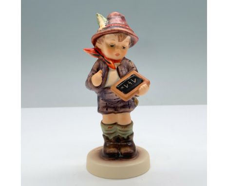 Hand-painted porcelain features a little boy with a chalkboard. Goebel backstamp. M. I. Hummel impressed on the round base. T
