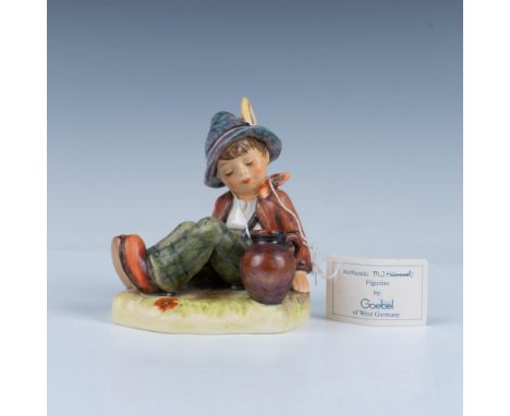Hand decorated exclusive special edition no.8 figure of a young boy taking a rest. Artist impressed signature on the base. Go
