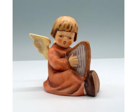 Hand painted porcelain with matte finish features little angel plating the harp. Goebel backstamp. Hummel-Hummel impressed. T