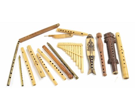 Group of fipple flutes and whistles of various nationalities including a bird call, a swanee whistle and a miskal (Turkish pa