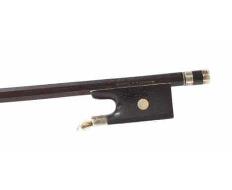 French silver mounted violin bow by and stamped A. Lamy ? Paris, the stick round, the ebony frog inlaid with pearl eyes and t