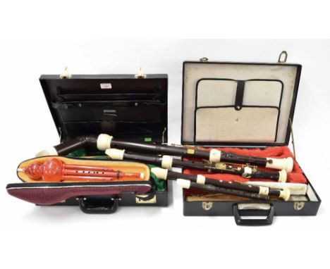 Set of four modified Yamaha recorders, comprising soprano, treble, tenor and bass, within two fitted adapted cases; also a co