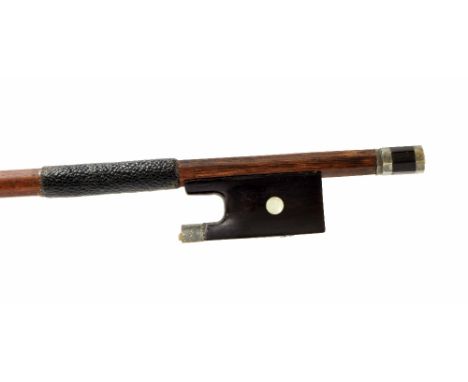 Silver mounted violin bow, unstamped, the stick round, the ebony frog inlaid with pearl eyes and the ebony adjuster with two 