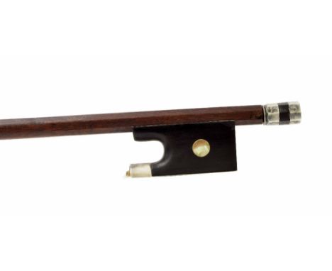 Good silver mounted violin bow, unstamped, the stick round, the ebony frog inlaid with pearl eyes and the ebony adjuster with