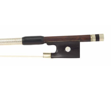 Nickel mounted violin bow stamped J. Martin, the stick round, the ebony frog inlaid with pearl eyes and the ebony adjuster wi