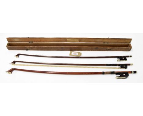 Old nickel mounted double bass bow and two nickel mounted violoncello bows; also a wooden bow box (4)