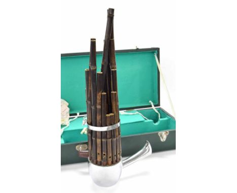 Sheng (Chinese mouth organ), the wind chest and mouth pipe of bright metal, seventeen bamboo tubes retained by a metal band, 