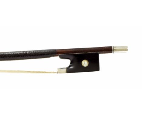 Interesting silver mounted violin bow, unstamped, the stick round, the ebony frog inlaid with pearl eyes and with a silver ov