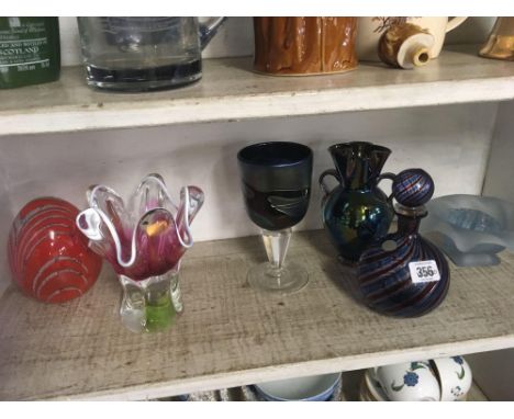 SHELF OF DECORATIVE COLOURED GLASSWARE