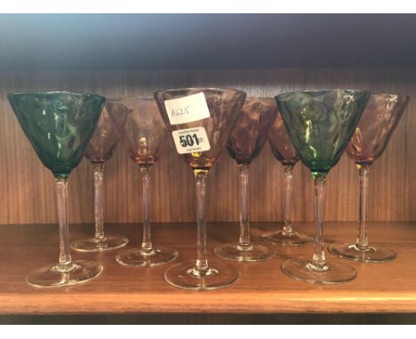 SHELF OF COLOURED COCKTAIL GLASSES