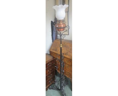 Cast metal standard lamp with shade, 181cm high