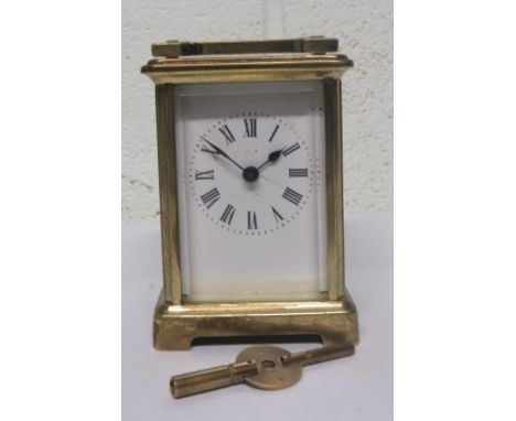 20th century brass gilt carriage clock, with Roman Numeral dial, makers mark indistinct, 11cm high