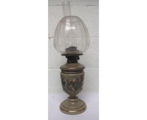 Green ground oil lamp decorated with birds amongst foliage, with chimney and an etched clear glass shade