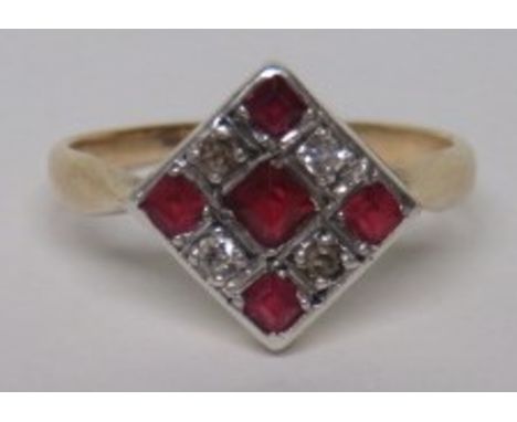 An art deco unmarked gold, platinum (both tested) diamond and ruby geometric panel ring, with five calibre cut rubies alterna