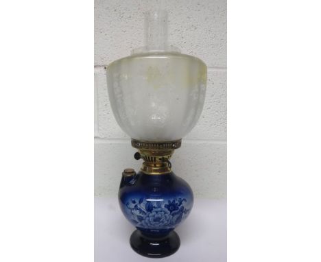 Victorian oil lamp, with a blue ceramic base and with floral decoration, with frosted shade and chimney, 48cm tall