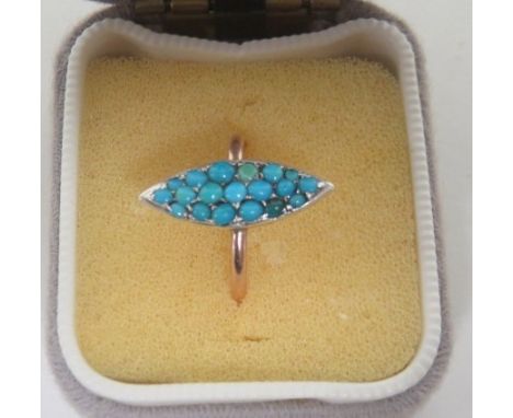 A marked 9ct gold rose gold ring, with a marquise shaped panel set with turquoise stones in various shades, panel length appr