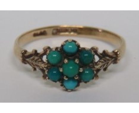 A marked 375 gold turquoise stone flower ring, set with openwork leaf design shoulders, the turquoise stones of various shade