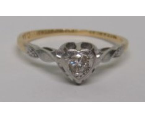 A marked 18ct gold and Plat solitaire diamond ring, the round cut diamond measuring approximately 2.4mm in diameter and set i