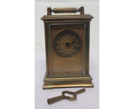 20th century gilt brass carriage clock with chapter ring and Arabic numerical dial 
