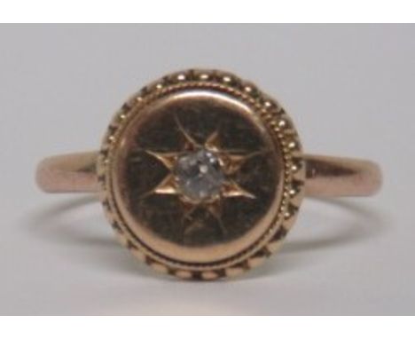 An early 20th century unmarked rose gold (tested) diamond star set ring, ring size N, weight 1.8g