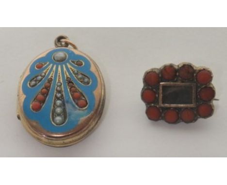 A 19th century (possibly Georgian) small mourning brooch set with ten round coral beads and a front compartment containing a 