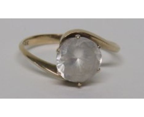 A marked 18ct gold dress ring set with a large faceted round cut Desert Diamond (Saudi Quartz), measuring approximately 4.6mm
