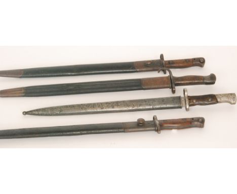 A 1907 Wilkinson pattern bayonet and scabbard with two Sanderson pattern 1907 bayonets and a similar bayonet stamped and numb