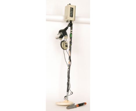 An Arado model 120B metal detector, a pair of Tandy T16 headphones and a trowel (3)