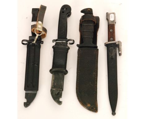 An American knife and scabbard, the blade stamped Ontario USA, another bayonet and two saw back bayonets and scabbards marked