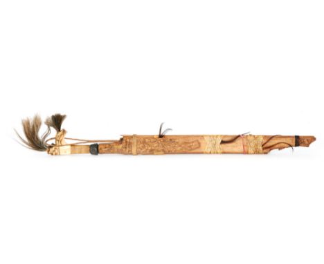 A Dajak carved bone handled short sword in decorative scabbard, an African short sword with ebonised shaped handle, a Chinese