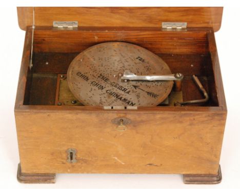 A disc musical box playing 8 inch discs on a single comb, serial No 32561 in transfer printed walnut case, width 41cm